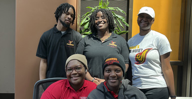 Group of five UDC students smiling