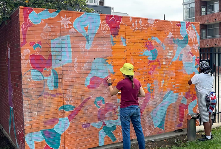Old mural being sanded.