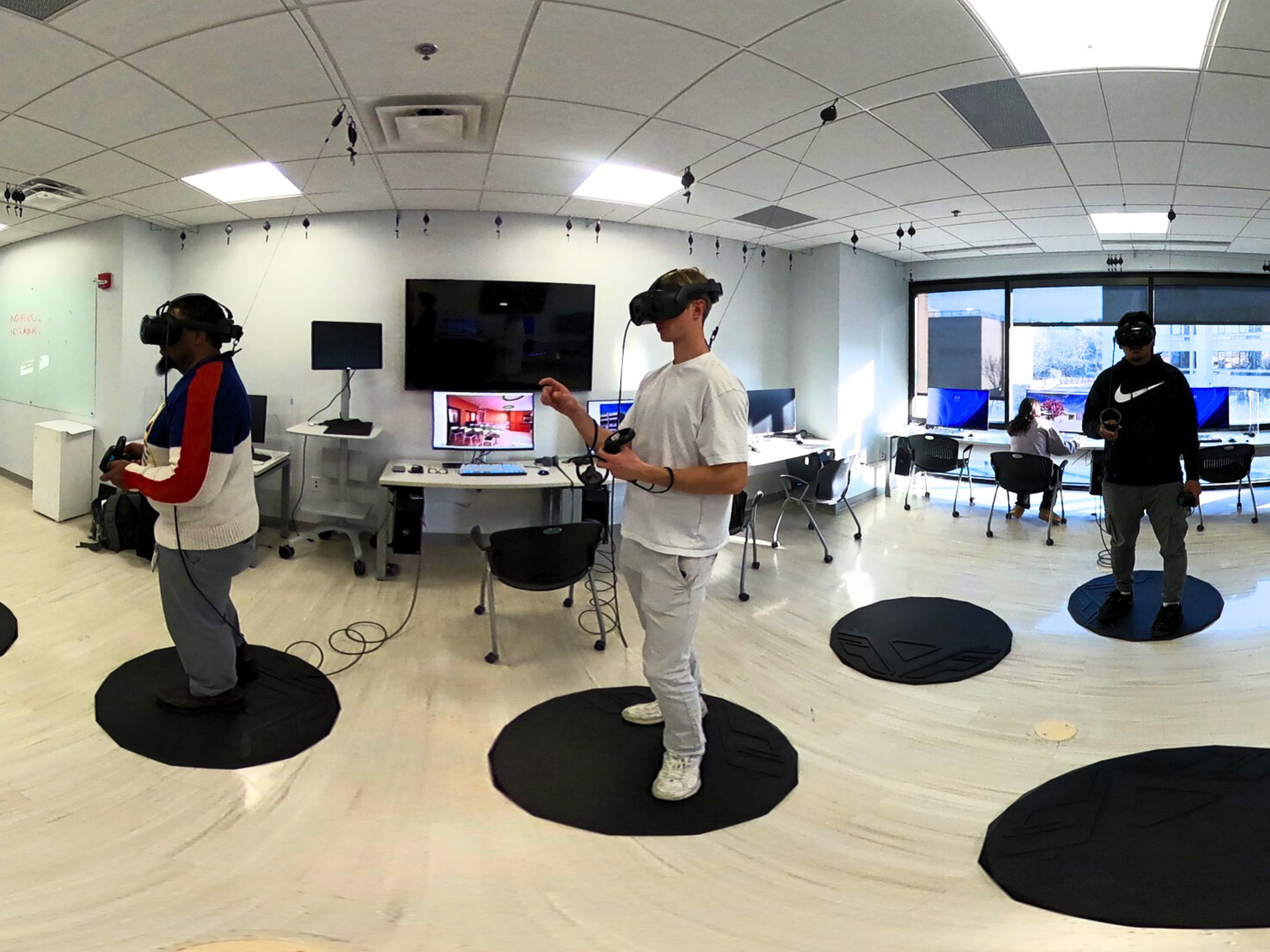 Students using virtual reality in the Firebird Immersive Innovation Laboratory and Maker Space.