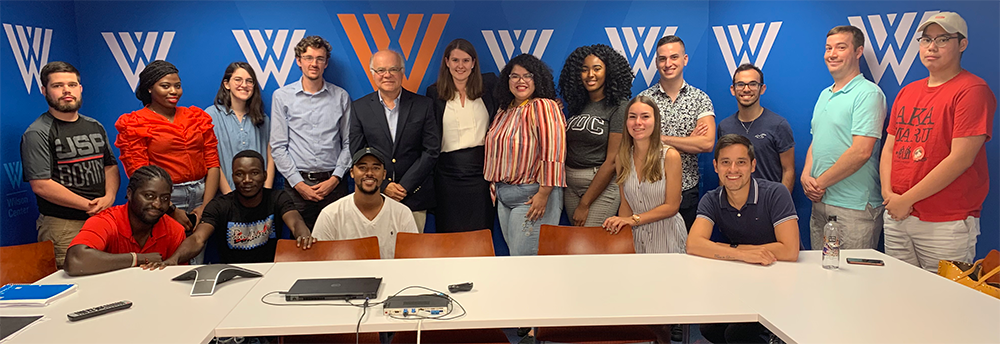 Students from Dr. Kevin Funk’s “Brazilian Politics and Society” course visited the Wilson Center’s Brazil Institute on September 12, 2019. The Institute’s director, Paulo Sotero, accompanied by associate Anna Prusa (both pictured, center), discussed and answered student questions about U.S.-Brazilian relations, the political and economic agenda of Brazilian president Jair Bolsonaro, and the current environmental and other challenges – including the spate of recent fires in the Amazon – facing both Brazil as well as the international community. Dr. Kevin Funk is an Assistant Professor of Political Science.