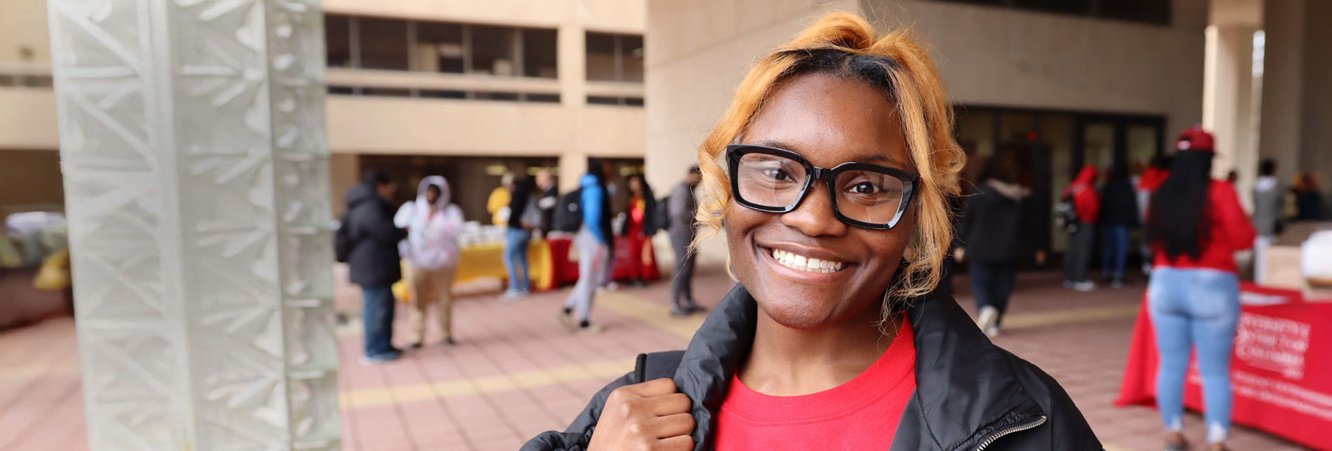 Female UDC student smiling.