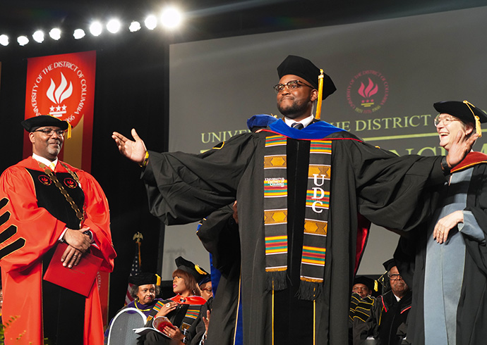 A UDC PhD candidate at Commencement