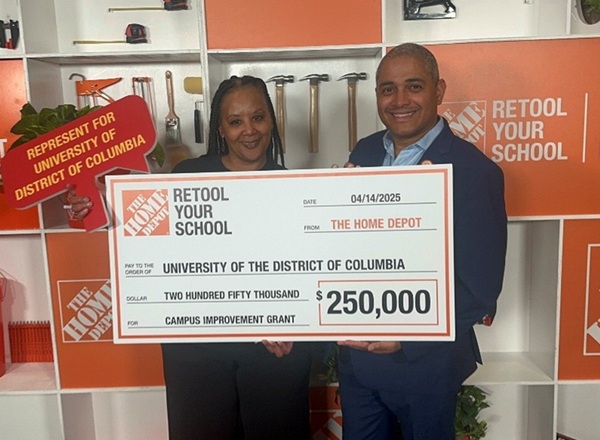 Maria Guillory from UDC accepting a $250K check from Home Depot 