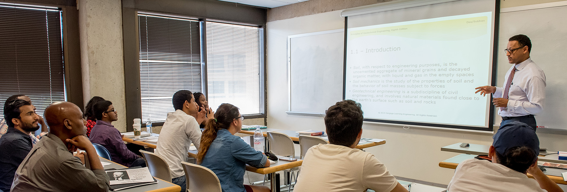 A man teaching a college class