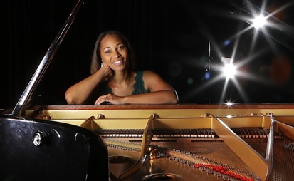 Professor sitting at a piano