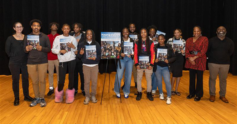 Anacostia High School Students holding their books.