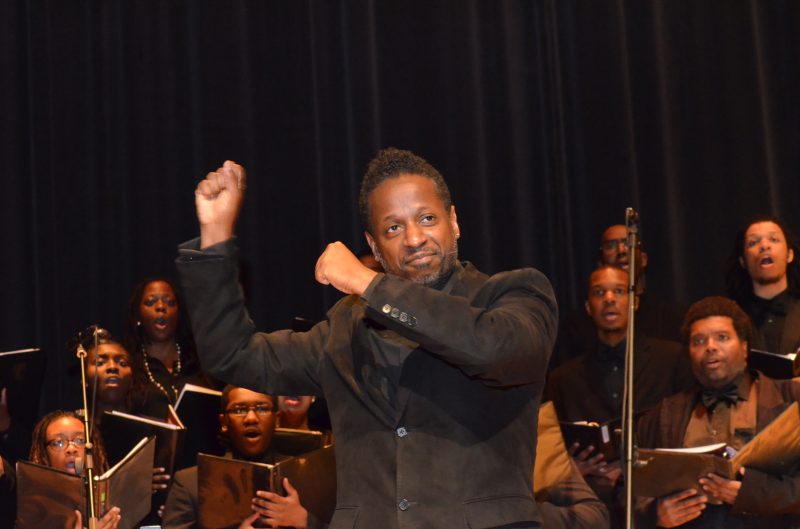 Conductor leading Gospel Choir