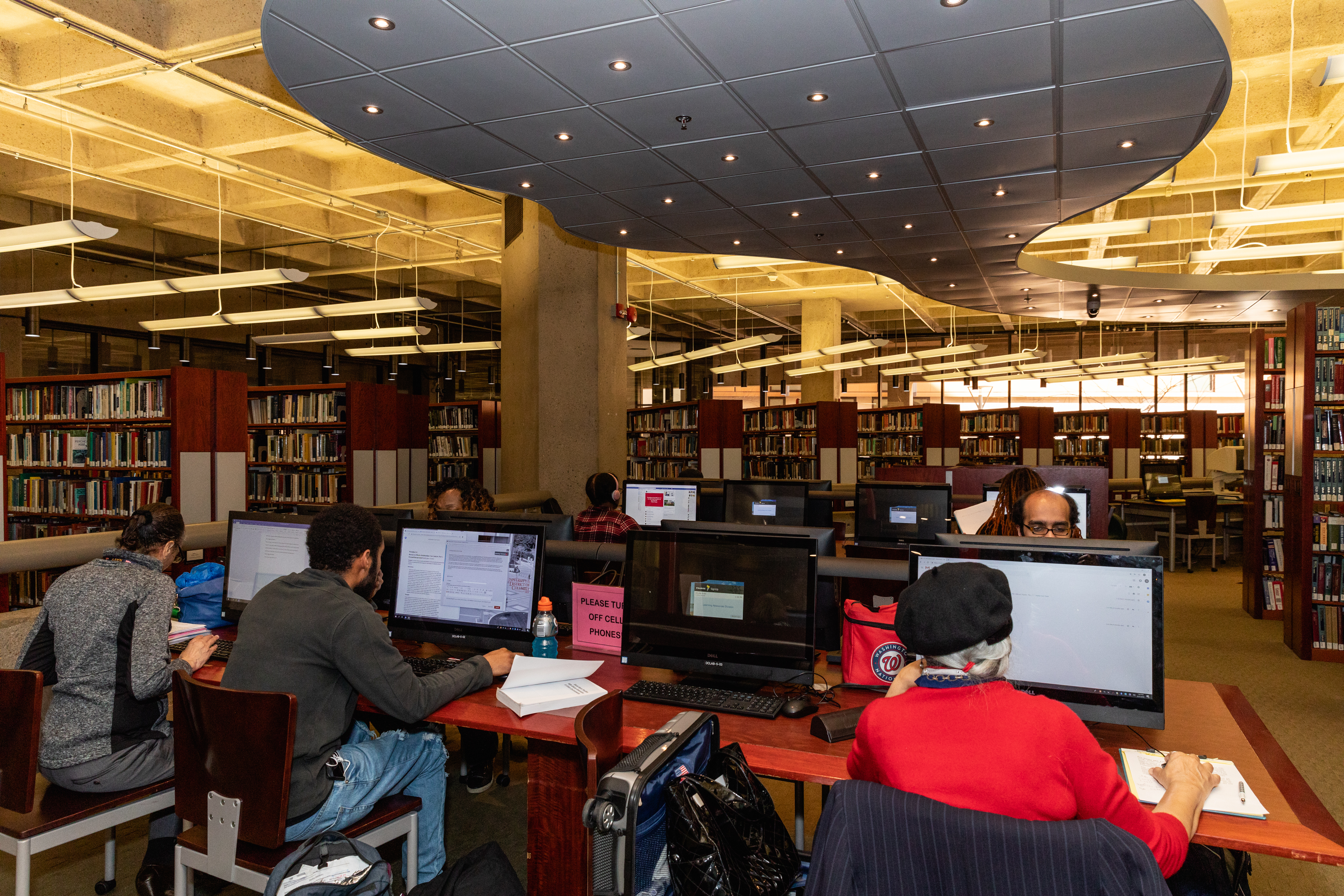 Students on computers in library