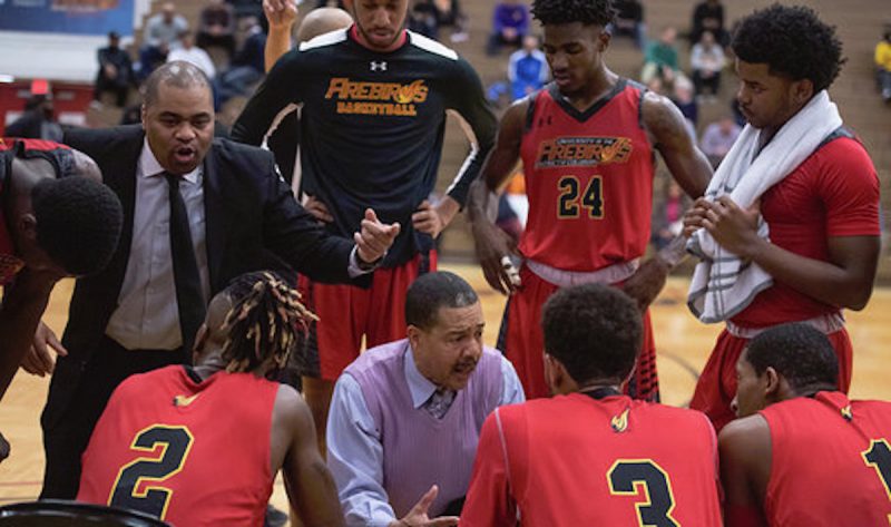 Basketball players huddling during timeout