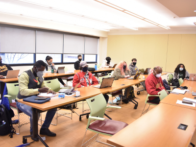 Students in a classroom with masks on.