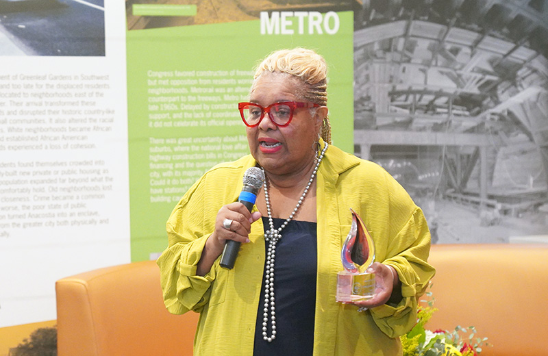 Trustee Antoinette White-Richardson speaking with a microphone