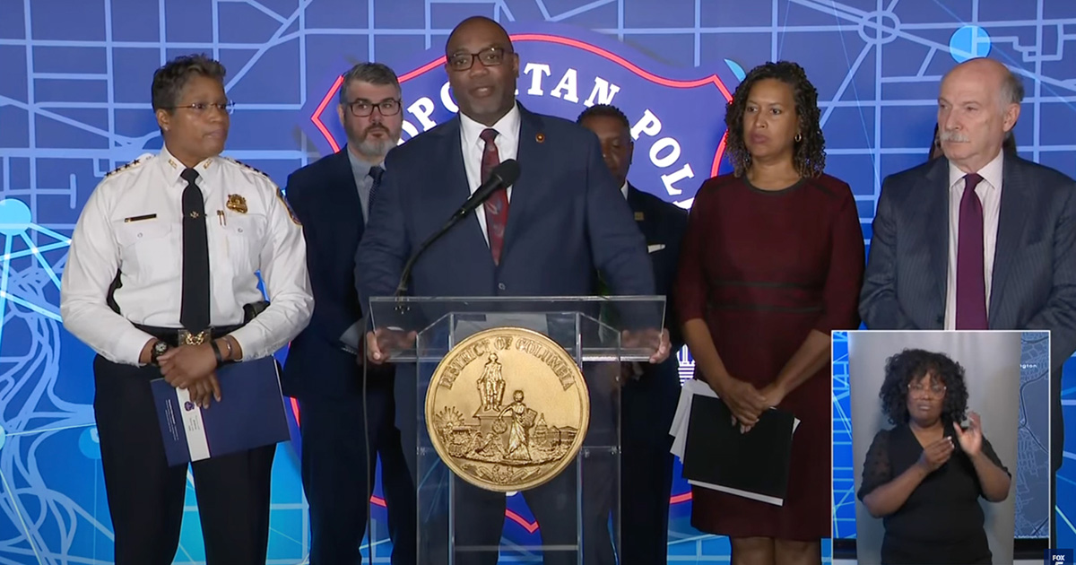 Maurice Edington speaking at a press conference with the mayor of DC