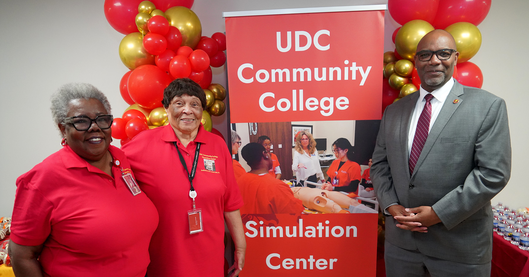 UDC Community College Dean Marilyn Hamilton, Vonda Rogers, assistant professor of nursing and chair of the simulation center planning committee, and President Maurice D. Edington.
