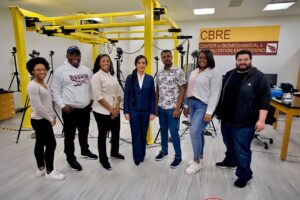 Dr. Lara Thompson in the Center for Biomechanical & Rehabilitation Engineering (CBRE) mobility lab with some of her students.