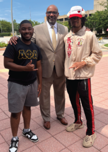 UDC President Maurice D. Edington, Ph.D., poses with USGA PresidentBrent Thigpen (left) and 2023-2024 Mr. Homecoming Jaeron Nichols (right) in Cleveland L. Dennard Plaza.