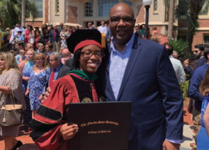 President Maurice D. Edington, Ph.D., poses with his daughter Gabby atgraduation at Florida State University’s College of Medicine.