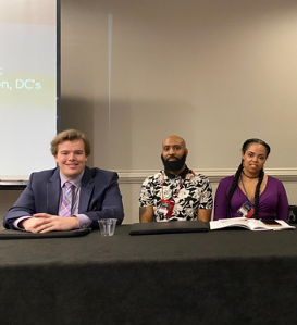 2020 UDC National Conference of Black Political Scientists delegation in Atlanta, GA. For the theme of “War on Blackness,” Benjamin Hoffschneider (left) examined Black women’s maternal mortality, Ruby Branscomb (right) and Randell Thomas (center) explored the housing crisis in DC’s communities of color and the #dontmuteDC movement to amplify DC culture, respectively.