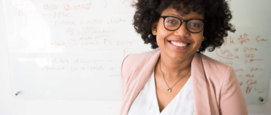 African American Woman in front of white board