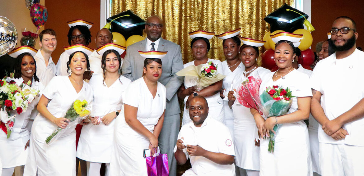 President Edington with nursing students at the 2023 Pinning Ceremony